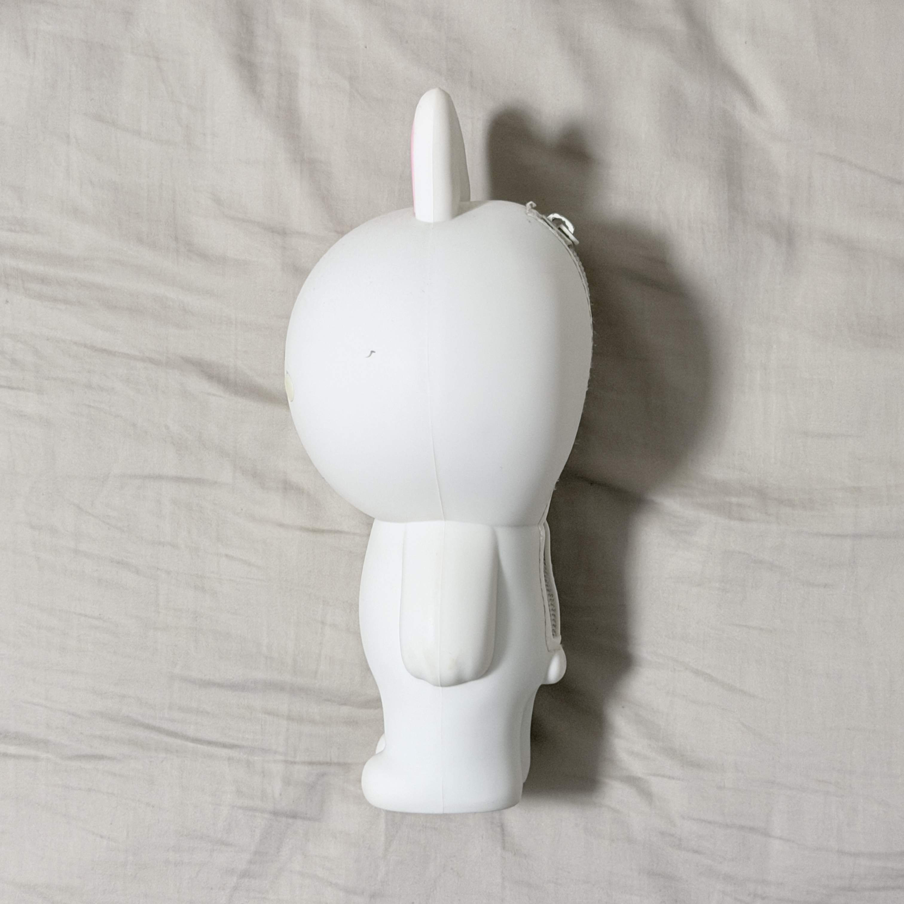 This is a photo of bunny from a side view.